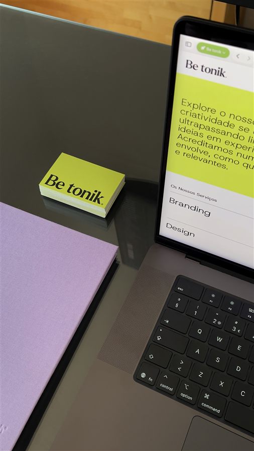 Be tonik branding materials next to a laptop