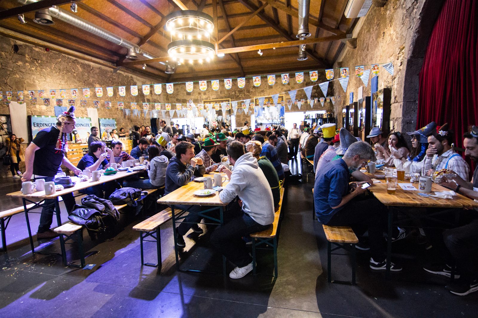 Guests sharing a meal at long tables during a social event