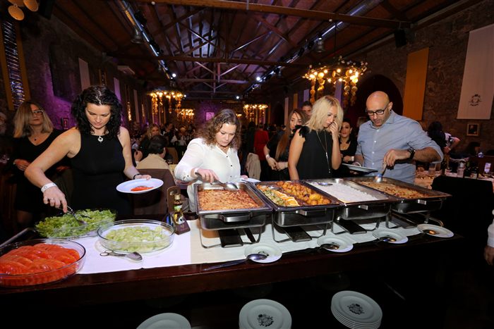 Guests serving themselves at a buffet